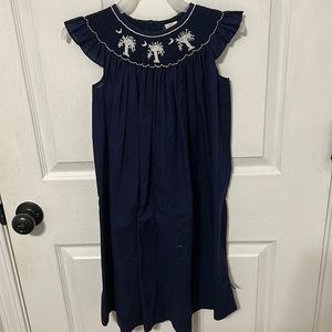 I am selling a smocked dress with palmetto trees.